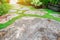 BeautifulÂ garden and stone path and  blooming flower and tree with green leaves